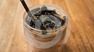 Ice milk cincau is a traditional cold beverage from Indonesia or iced grass jelly with milk and brown sugar