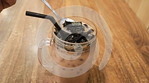 Ice milk cincau is a traditional cold beverage from Indonesia or iced grass jelly with milk and brown sugar