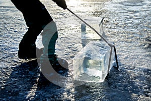 `Ice Miners` workers mine large cubes of natural river ice