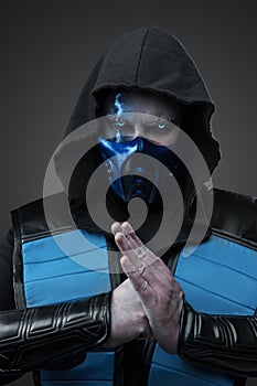 Ice ninja with fist and palm against grey background