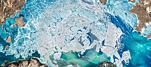 Ice pattern on satellite photo, aerial top view of blue glaciers