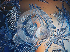 Ice Pattern on winter Glass in the frost at sunset. Ice Pattern on glass are shot in macro. Ice Pattern on glass look futuristic a