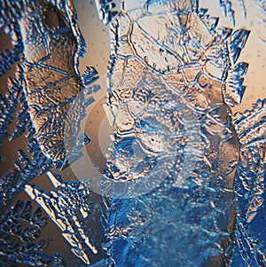 Ice Pattern on winter Glass in the frost at sunset. Ice Pattern on glass are shot in macro. Ice Pattern on glass look futuristic a