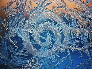 Ice Pattern on winter Glass in the frost at sunset. Ice Pattern on glass are shot in macro. Ice Pattern on glass look futuristic a