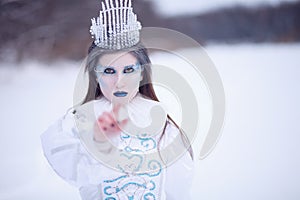 Ice queen in winter landscape