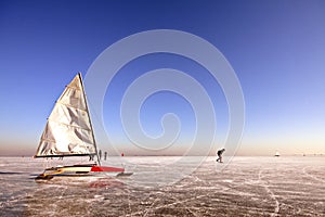 Ice sailing and skating on a cold winterday