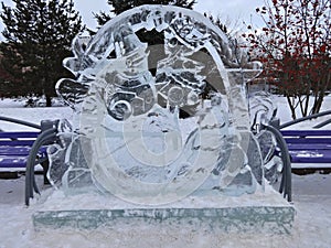 An ice sculpture of a snowman in winter Park