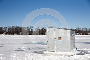 Ice Shanty on a Frozen Lake photo