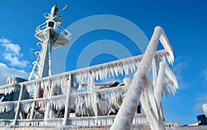 Ice of the ship and ship structures after swimming in frosty weather during a storm in the Pacific Ocean.