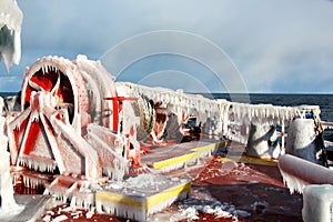 Ice of the ship and ship structures after swimming in frosty weather during a storm in the Pacific Ocean.