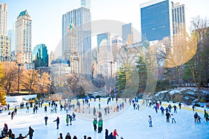 Ice skaters having fun in New York Central Park in winter