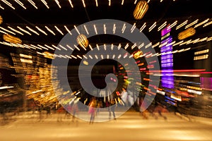 Ice Skaters And Holiday Lights Blur