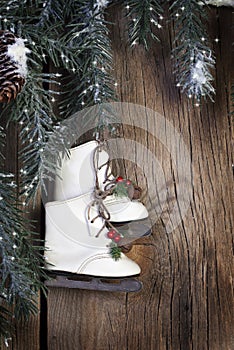 Ice Skates with Evergreen Boughs