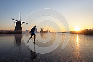 Ice skating at sunrise in the Netherlands