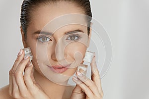 Ice On Skin. Woman Doing Face Skin Treatment
