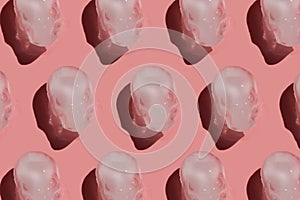 Ice skull with shadow pattern on a pink background