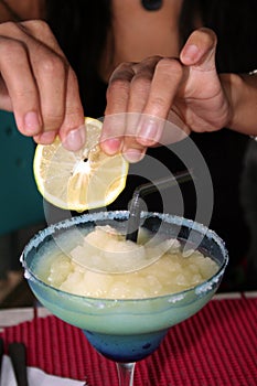 ice and a slice frozen cocktail squeezing lemon