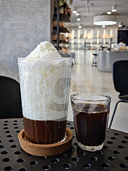 Ice snowy milk and cold coffee in a relaxing cafe.