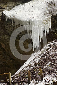 Ice stalagmites in ice cave., Scarisoara, Apuseni mountains, Romania. photo