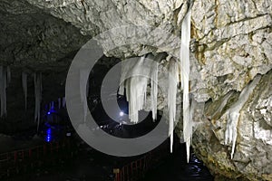 Ice stalagmites in ice cave., Scarisoara, Apuseni mountains, Romania photo