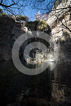 ice stalagtites formed in a natural waterfall