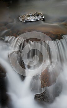 Ice stone and flowing water