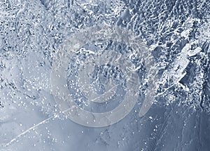 Ice structure plate on a blue background from the refrigeration equipment, cool in the summer heat