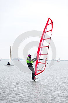 Ice surfing on the frozen Gouwzee in Monnickendam.