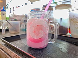 ice sweet pink milk in street drinking shop