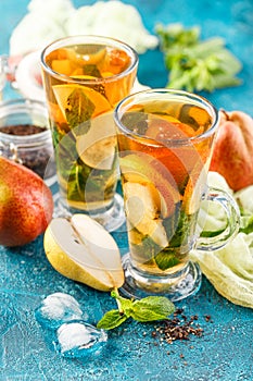 Ice tea with mint leaves and pear