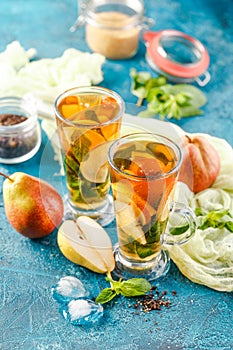 Ice tea with mint leaves and pear