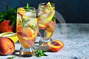 Ice tea with peach and lemon. Cold drink.