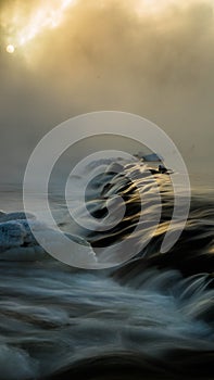 Ice thaws in the rough river