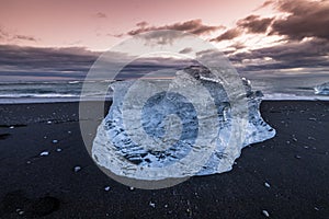 Ice washed up on Iceland black sand beach
