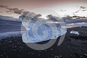 Ice washed up on Iceland black sand beach