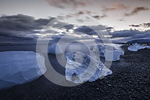 Ice washed up on Iceland black sand beach