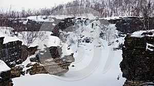 Ice waterfall in Abisko canyon in Abisko National Park in Sweden in winter