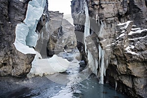ice wedging splitting apart a rock formation photo
