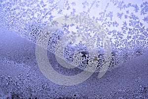 Ice on the window glass, natural background texture close-up