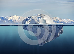 Iceberg with above and underwater view photo