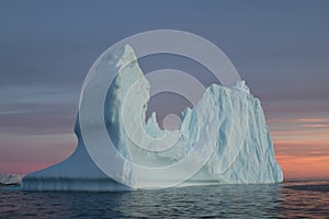 Iceberg in Antarctic waters at sunset