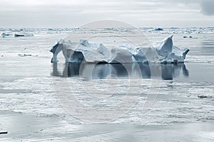 Iceberg in calm waters