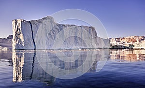 Iceberg floating in greenland fjord