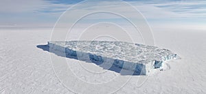 Iceberg in frozen Arctic Ocean