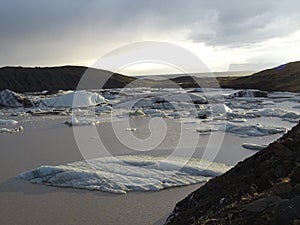 Iceberg in a glacier lake in Iceland, in the sunset light.