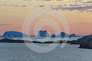 Iceberg group near Fogo Island at sunset