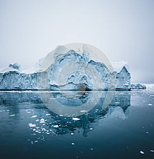 Iceberg and ice from glacier in arctic nature landscape in Ilulissat,Greenland. Aerial drone photo of icebergs in