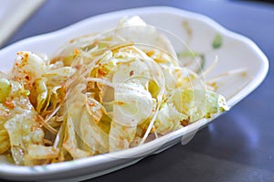 Iceberg lettuce salad with gimchi sauce , Korean food photo