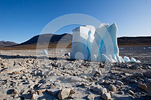 Iceberg in the middle of a dried out lake