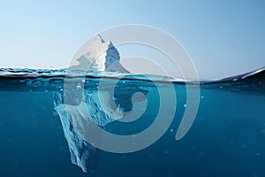 Iceberg in the ocean with a view under water. Crystal clear water. Hidden Danger And Global Warming Concept.